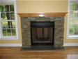 Large gas fireplaces with stone surrounds provide a strong and stately look to this modular home
